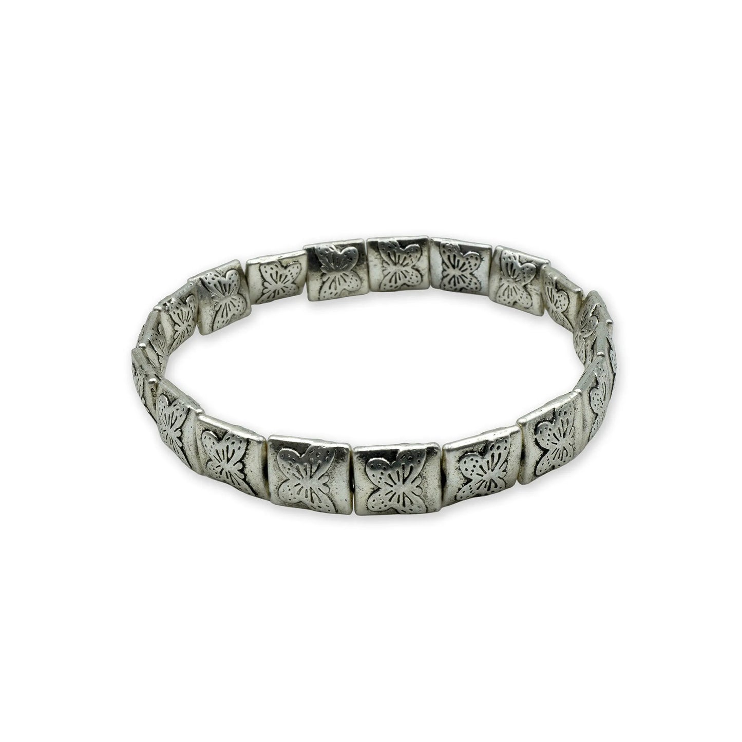 Side view of handmade botanical bracelet with silver-plated engraved beads.