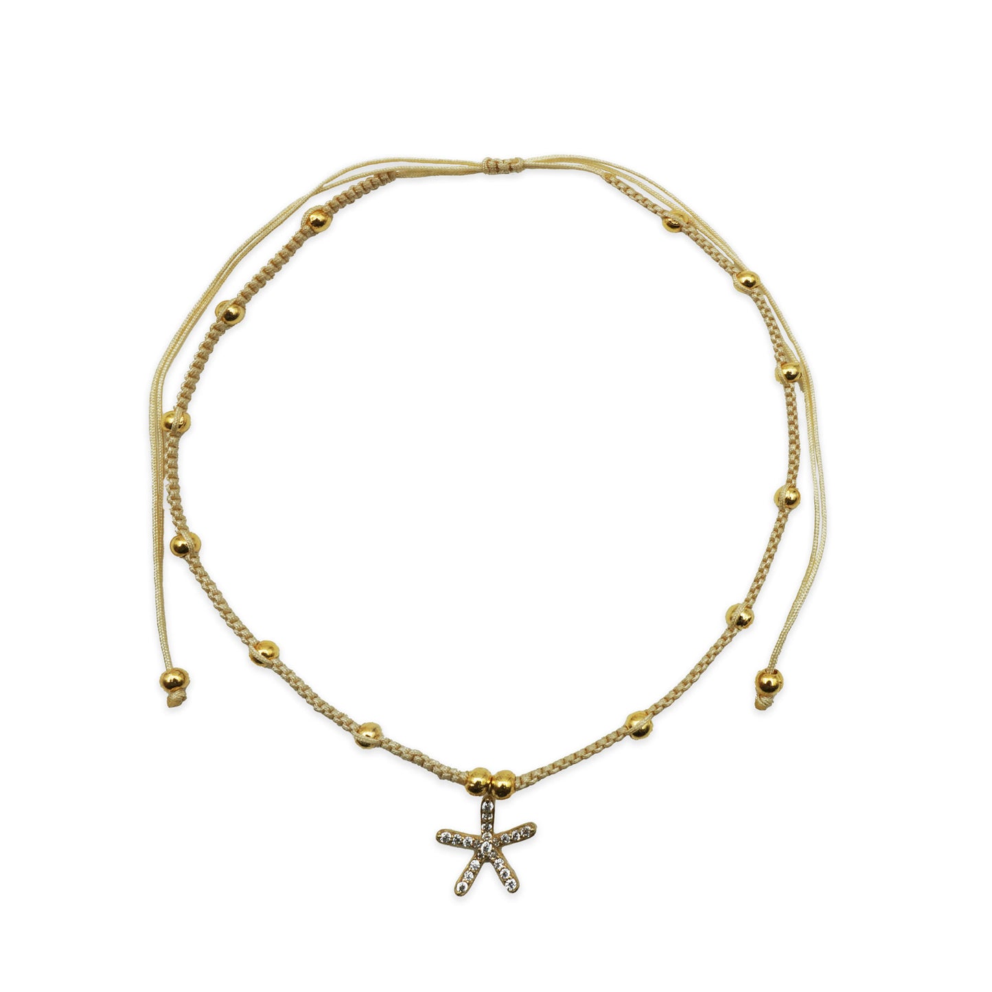 Alt Text: Scale view of the Golden Starfish Anklet handmade in Bali. Features golden starfish charm with shimmering beads, showing fit and lightweight coastal elegance.
