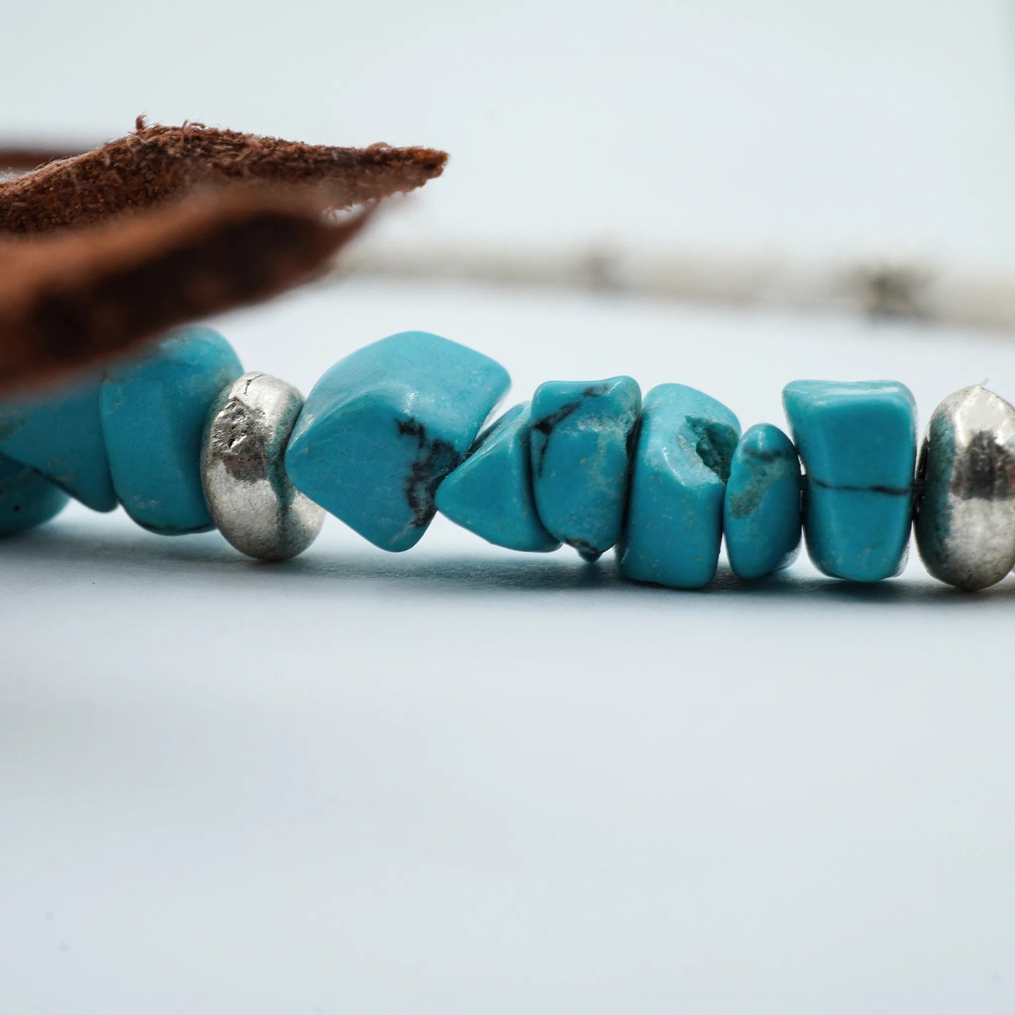Close-up of the Ocean Spirit Sliding Knot Anklet handmade in Bali. Detailed shell and bead textures, with artisanal knotting inspired by bohemian coastal charm.
