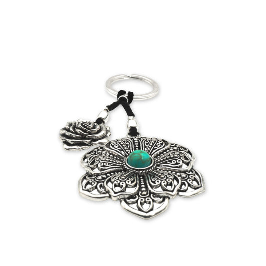 Front view of the Boho Bloom Flower Keychain featuring a detailed mandala-style charm with a vibrant turquoise stone at the center, handcrafted in a vintage bohemian style.