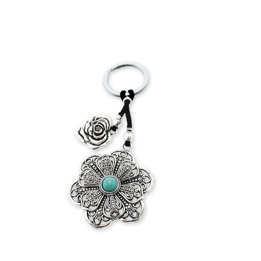 Top view of the Boho Bloom Flower Keychain showcasing its intricately designed mandala charm with a turquoise centerpiece, evoking a handcrafted, boho-inspired vintage aesthetic.