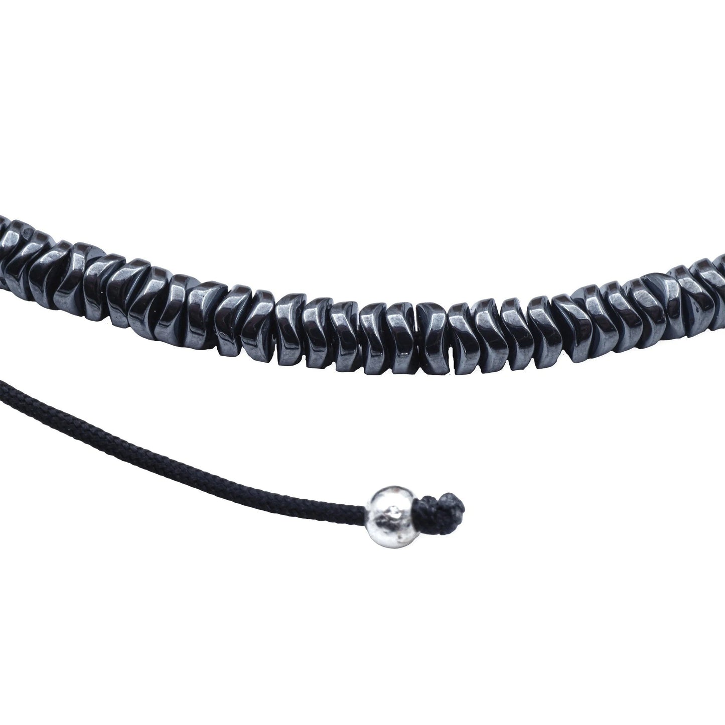 Close-up of Camins Midnight Hematite Necklace with dark reflective beads and adjustable sliding knot, handmade in Bali with minimalist boho elegance.