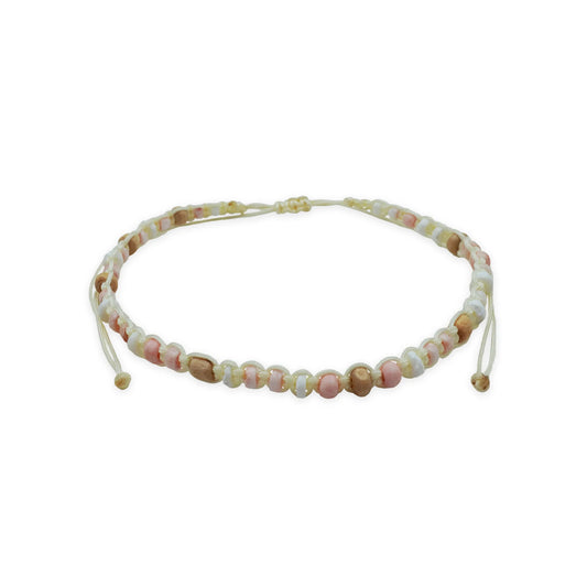 Front view of the Coastal Harmony Anklet, handmade with shell disc beads, wood beads, and pastel glass accents, finished with a sliding knot closure. The design captures coastal-inspired simplicity and artisanal Balinese craftsmanship.