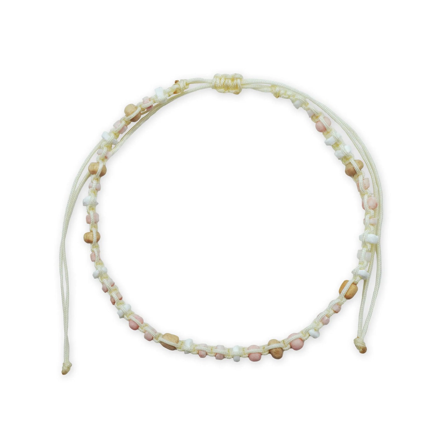 Scale view of the Coastal Harmony Anklet, showcasing its full circular form with white shell disc beads, natural wood beads, and soft pastel glass accents. The sliding knot closure highlights its adjustable, handmade Balinese design.