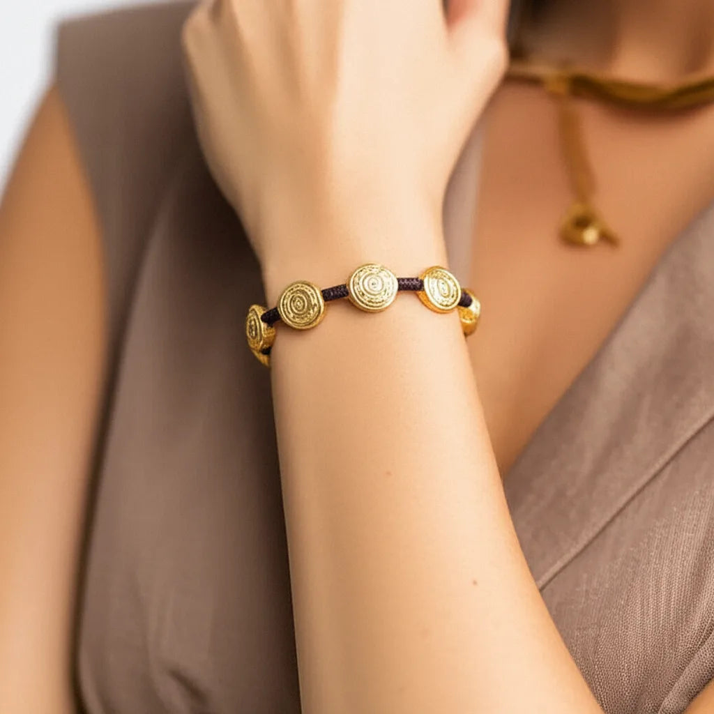 Golden Spiral Medallion Bracelet – Handcrafted Symbolic Elegance from Bali