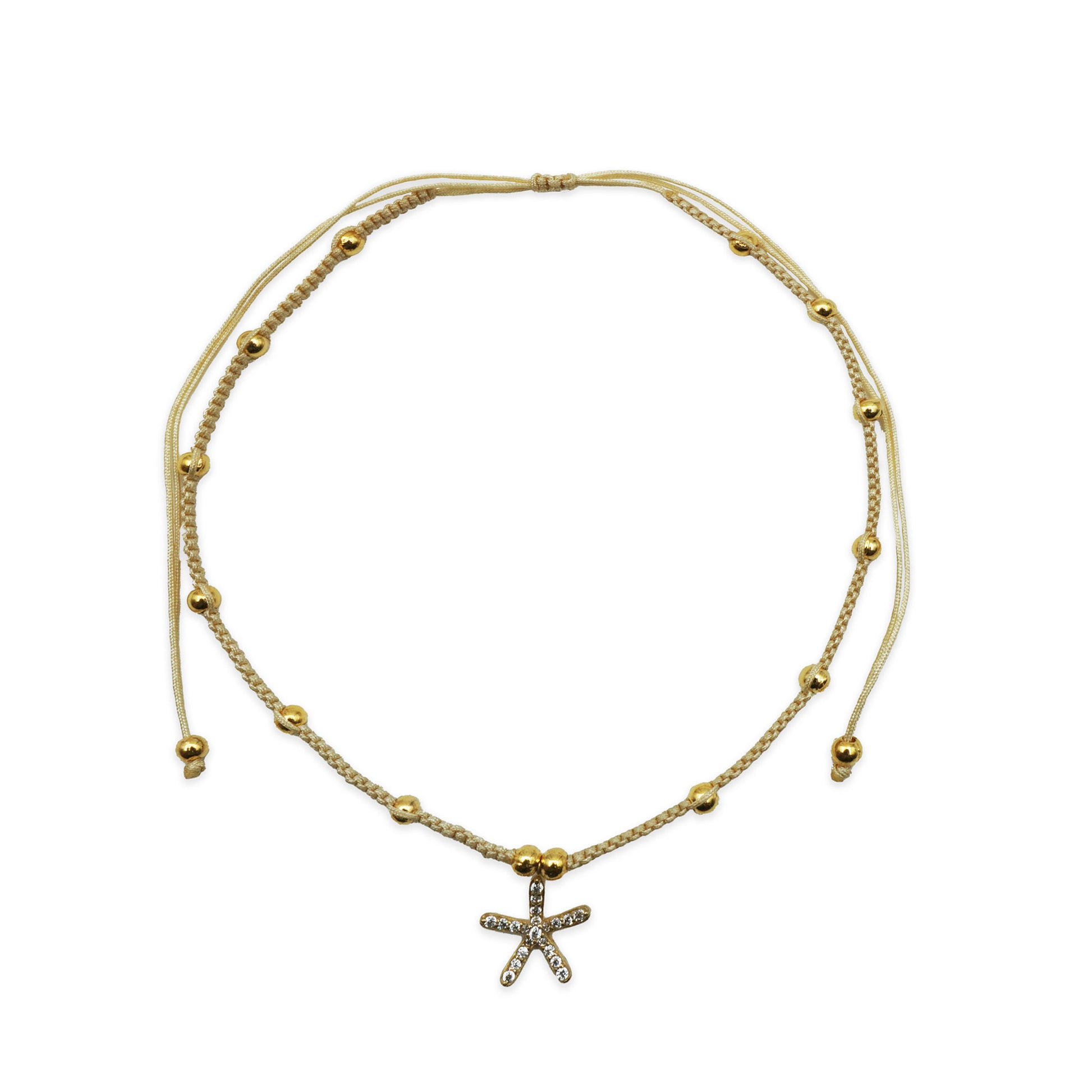 Alt Text: Scale view of the Golden Starfish Anklet handmade in Bali. Features golden starfish charm with shimmering beads, showing fit and lightweight coastal elegance.