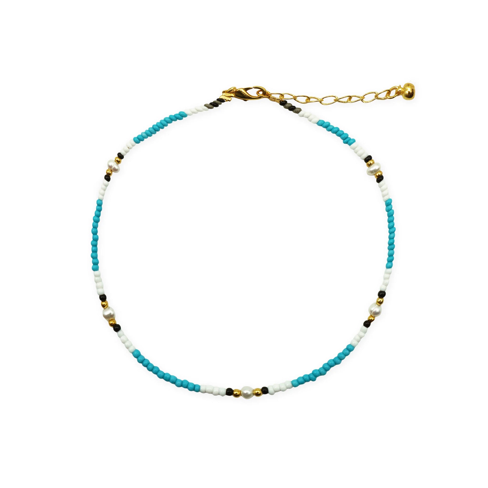 Scale view of Balinese anklet with freshwater pearls, glass beads, and golden accents.