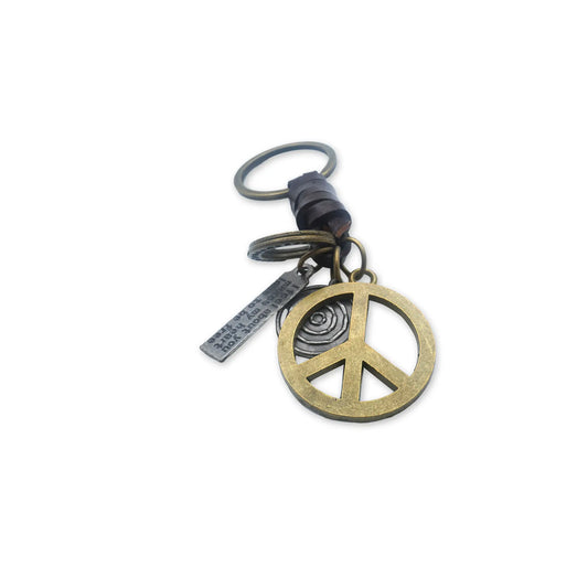 Vintage Peace Charm Keychain – Handmade accessory featuring a classic peace symbol charm, embodying style and harmony with a retro aesthetic.