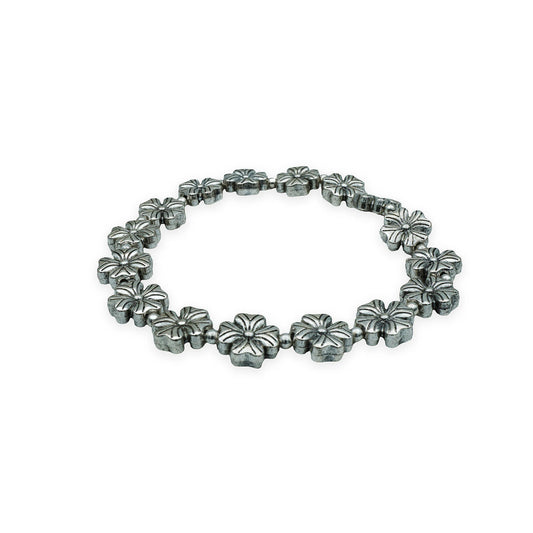 Side view of the Blooming Blossom Bracelet highlighting its delicate floral charm beads and artisanal handmade detail from Bali.
