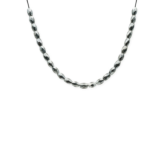 Close-up front view of the Isla Reflections Sliding Necklace featuring faceted silver beads on a silk cord, handmade in Bali with minimalist Mediterranean style.