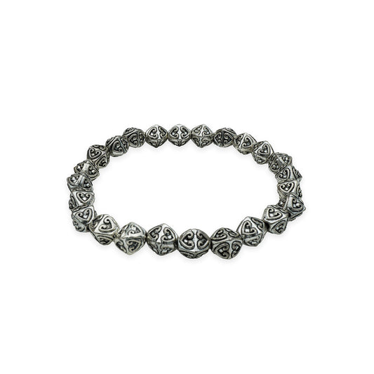 Side view of the Enchanted Hearts Bracelet, featuring silver heart charms with romantic boho style, handmade in Bali.