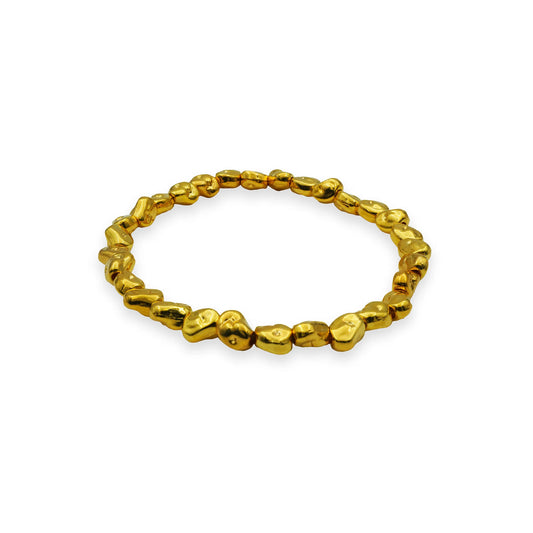 Side view of the Golden Nugget Stretch Bracelet with organically shaped gold-toned beads, showcasing sculptural elegance and artisanal craftsmanship.