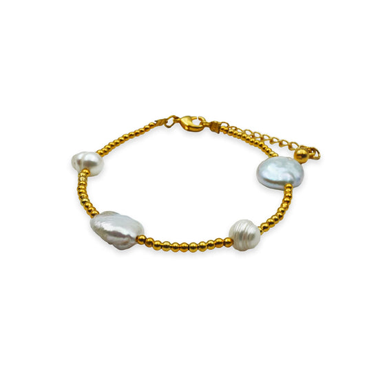 Front view of the Golden Radiance Pearl Bracelet featuring luminous pearls with golden bead accents, handmade in Bali for an elegant contrast and natural boho glow.