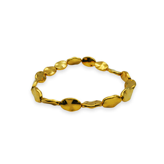 Side profile of the Golden Ripple Stretch Bracelet showing the dimensional shape of each golden bead, highlighting Bali craftsmanship.


