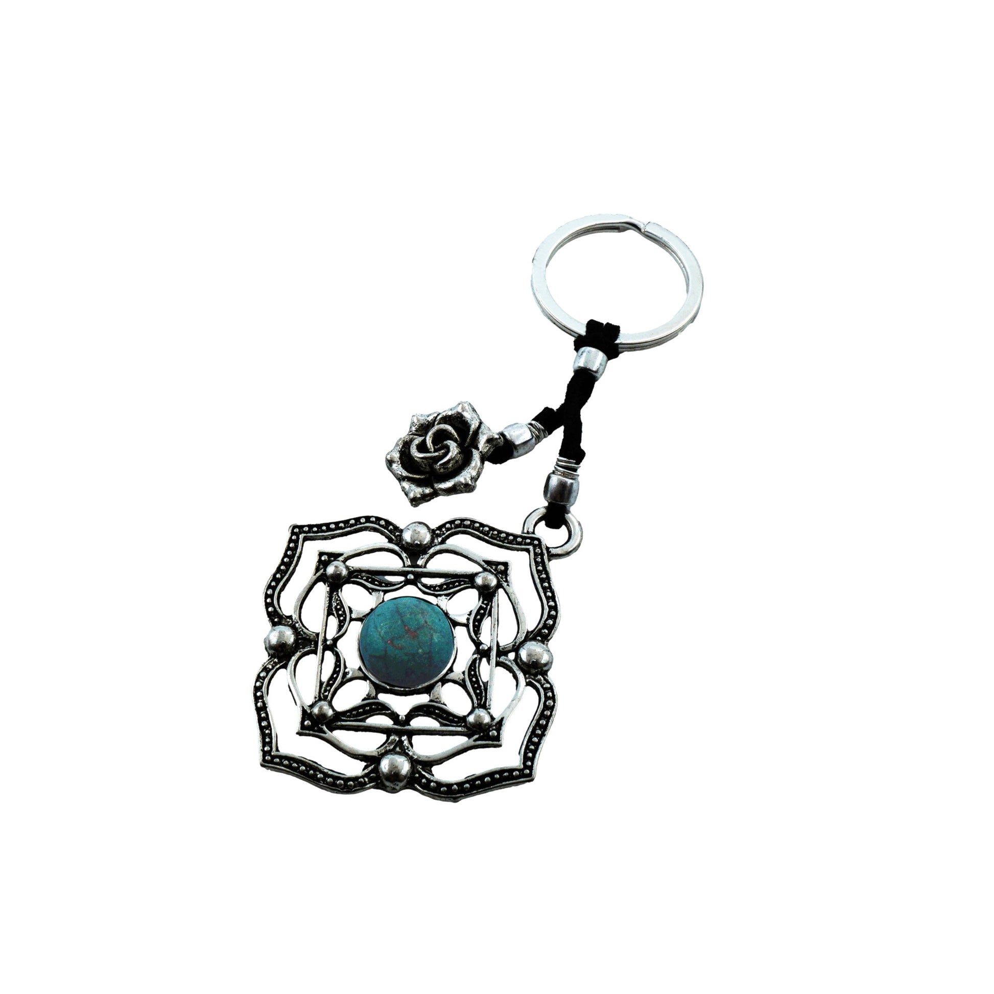 Top view of Boho Bloom Keychain showcasing its handmade flower-inspired form with a central stone detail and antique silver-plated finish, reflecting a vintage and boho-chic aesthetic.


