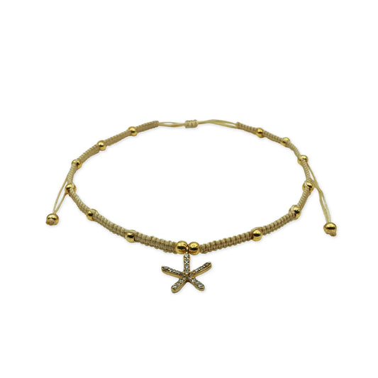 Alt Text: Front view of the Golden Starfish Anklet handmade in Bali with delicate sparkle beads and a golden starfish charm, blending coastal charm with artisanal detail.