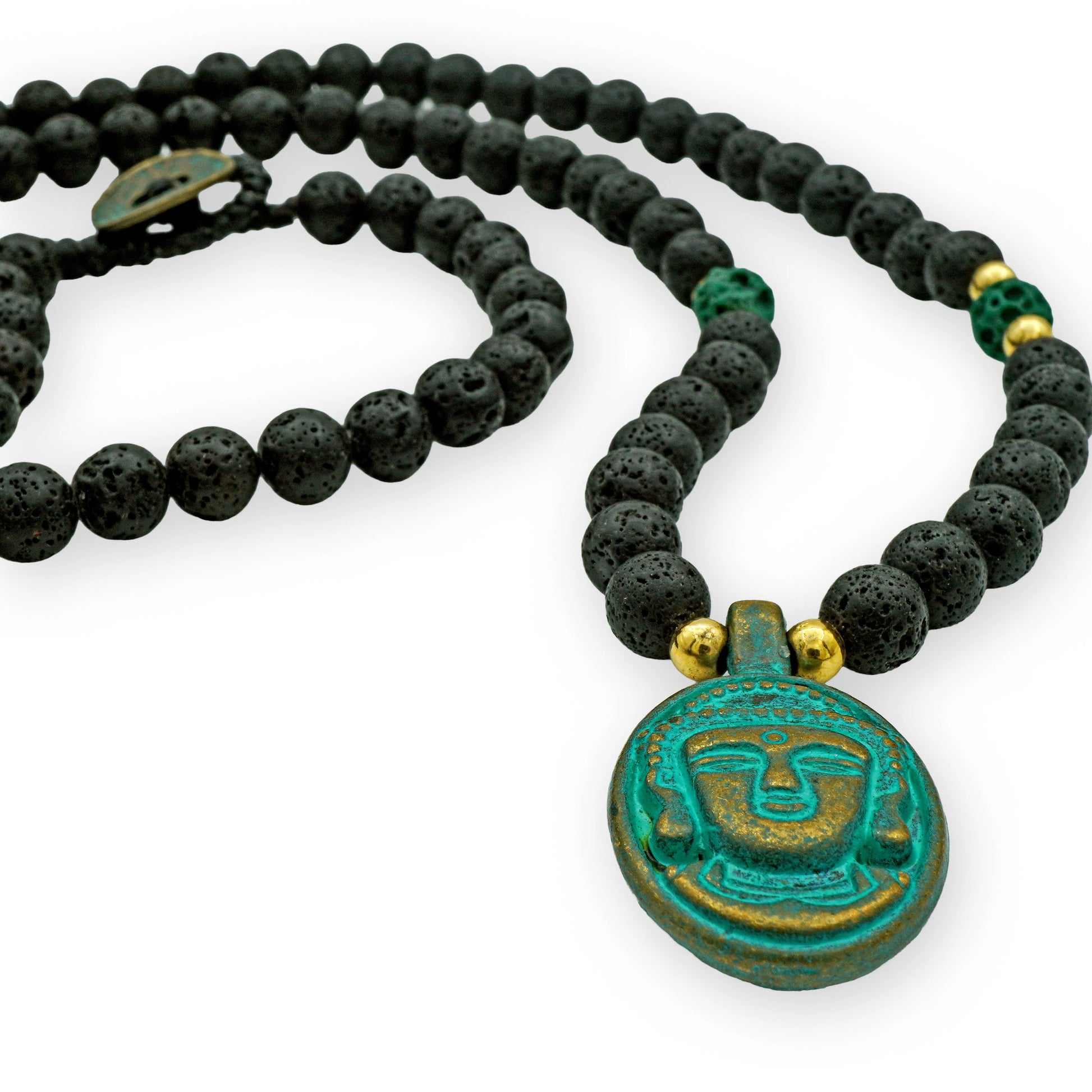 Top view of the Sacred Lava Buddha Pendant Necklace by Camins Fashion, featuring black lava beads, gold accents, and a green Buddha charm — handmade with spiritual inspiration in Bali.