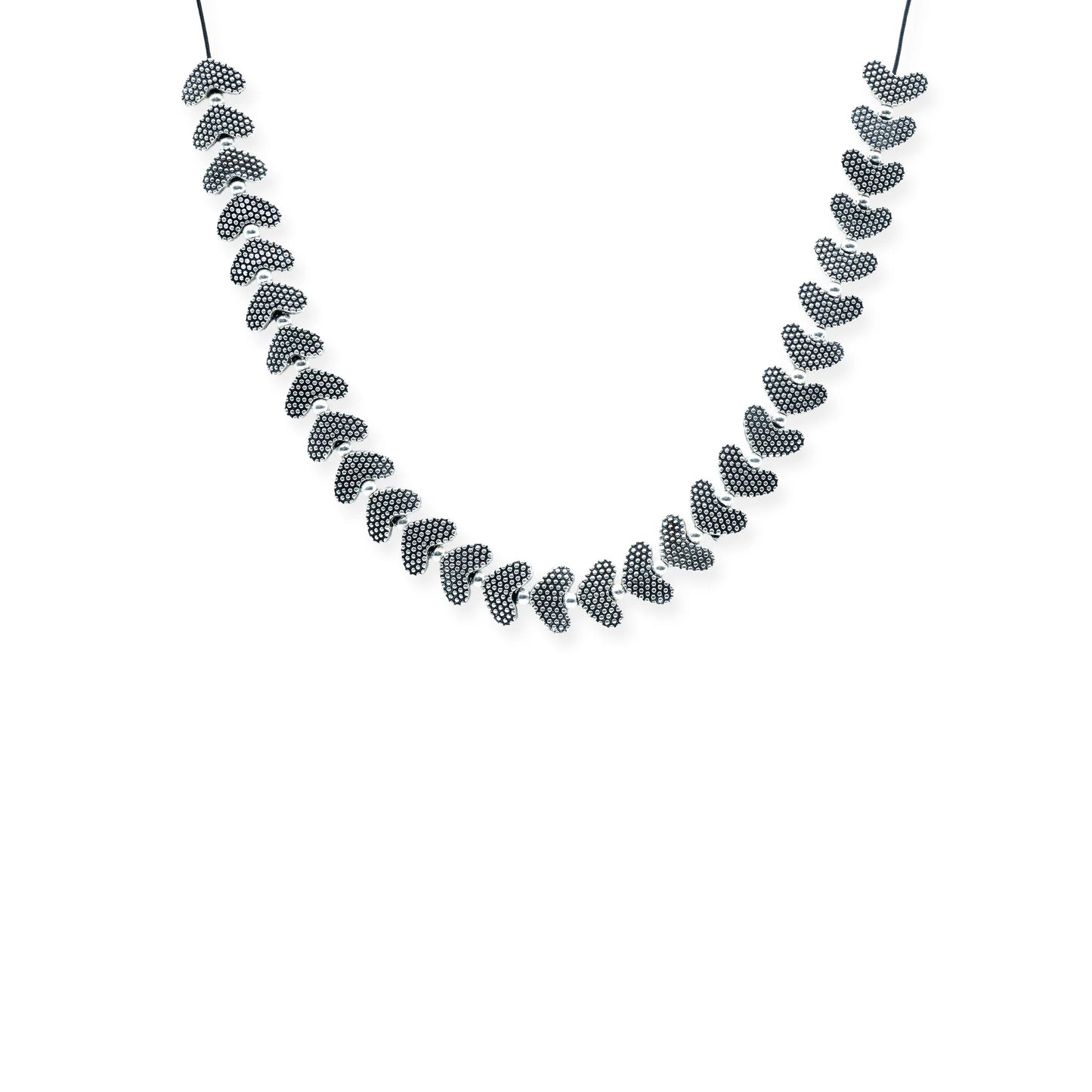 Front view of the Silver Heartbeat Sliding Necklace, featuring silver-plated textured heart beads on a black silk cord, handmade in Bali.