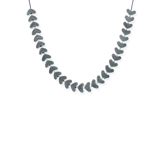 Front view of the Silver Heartbeat Sliding Necklace, featuring silver-plated textured heart beads on a black silk cord, handmade in Bali.