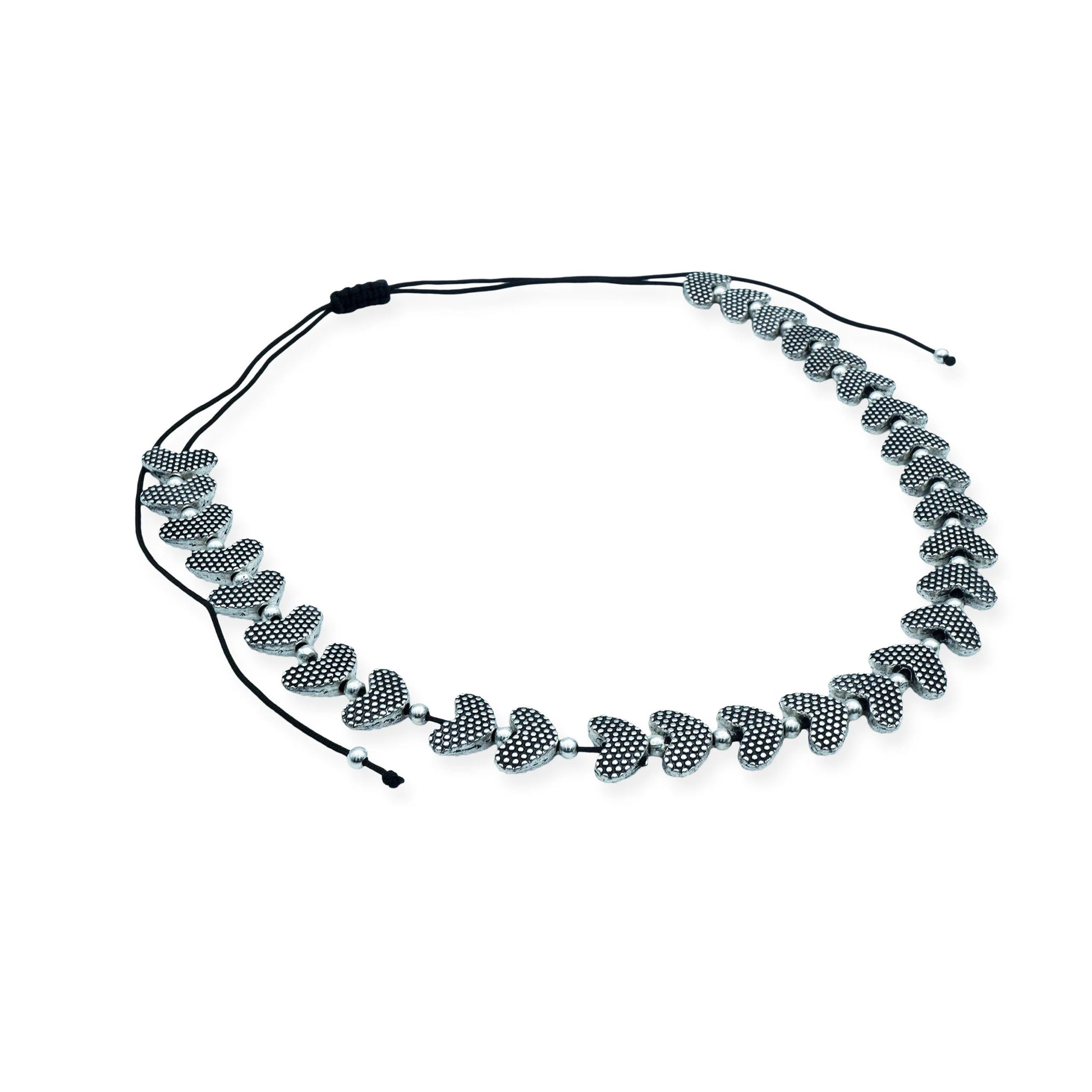 Top view of the Silver Heartbeat Sliding Necklace showing the full strand of silver-plated heart beads and adjustable silk cord, handcrafted in Bali.